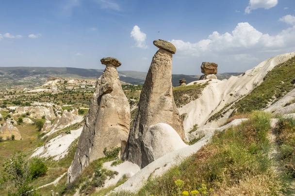 Urgup,Nevsehir,Turkey-May 29,2019.Three Graces are the brilliant three fairy chimneys located on Urgp, district of Nevsehir. It is the most famous natural beauty and symbol of Urgp. - Photo, Image