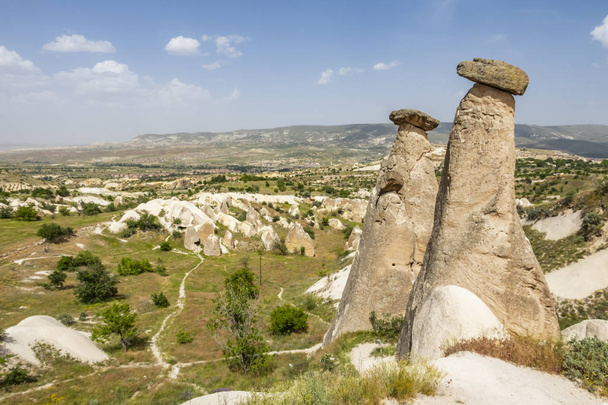 Urgup,Nevsehir,Turkey-May 29,2019.Three Graces are the brilliant three fairy chimneys located on Urgp, district of Nevsehir. It is the most famous natural beauty and symbol of Urgp. - Photo, image