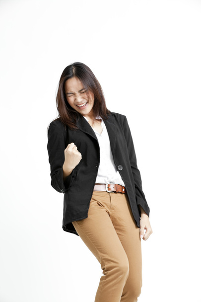 Portrait of a happy young business woman standing against white background - 写真・画像