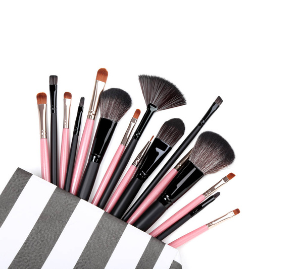 Makeup brushes in bag isolated on white background - Foto, Imagem
