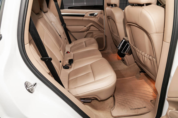 Novosibirsk, Russia  June 22, 2019:  Porsche Cayenne ,close-up of the beige leather  rear seats with seats belt. modern car interior - Foto, imagen