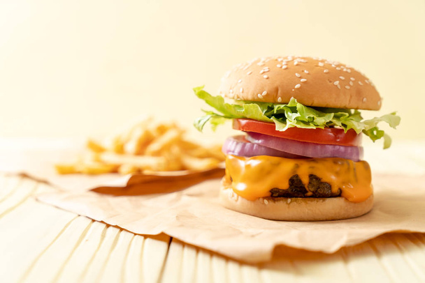 fresh tasty beef burger with cheese and french fries - Foto, Imagen