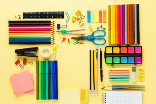 Set of school stationery and supplies on yellow background. - Photo, image