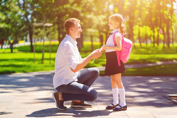 father leads daughter to school in first grade. first day at school. back to school - Photo, Image