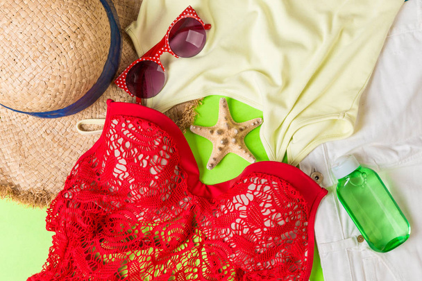 Woman summer outfit top view on color background. Fashion vacations concept - Photo, Image