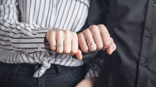 Hands of a guy and a girl with wedding ring. - Fotoğraf, Görsel