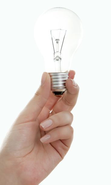 light bulb in hand, isolated on white - 写真・画像