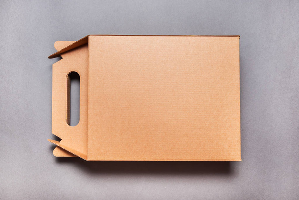 Brown craft cardboard box with handle - Zdjęcie, obraz