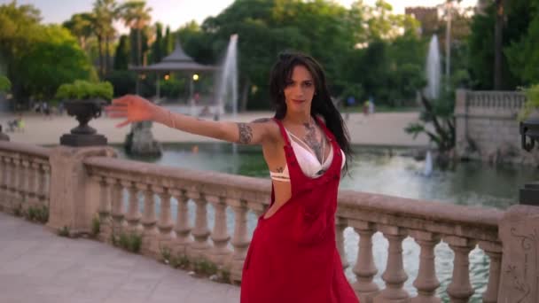 Ladyboy tattooed transgender model is dancing in the green park - Footage, Video