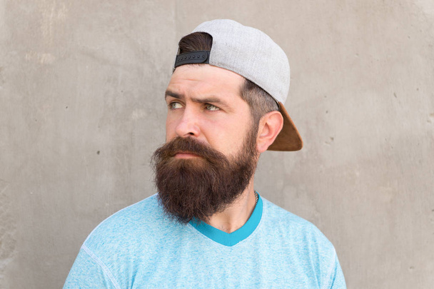 Barber salon and facial hair care. Beard and mustache grooming. Hipster lifestyle. Cool hipster with beard wear stylish baseball cap. Brutal handsome mature hipster man. Bearded man trendy style - 写真・画像