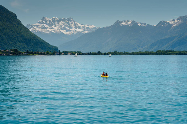 Swiss Alps mountain and Lake Geneva landscape with tourist paddl - Photo, Image