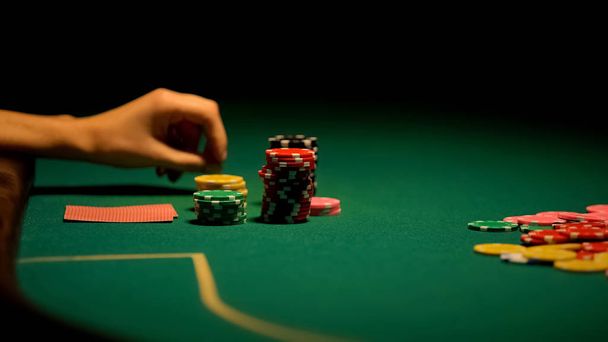 Female hand playing poker, gambling addiction, beginner in casino, fortune - Foto, Imagen