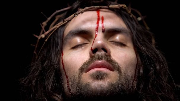 Closeup of bloody Jesus head with crown of thorns, crucifying Christ, agony - Fotoğraf, Görsel