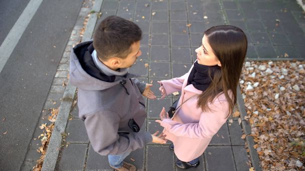 Couple arguing on street, relationship crisis, misunderstanding problem break up - Фото, изображение