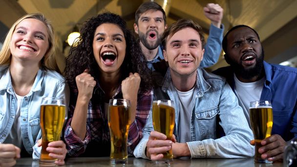 Multiethnic friends screaming supporting favorite sport team, celebrating goal - Photo, Image