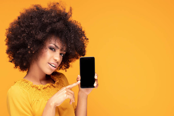 Excited afro girl with mobile phone. - Foto, Imagen