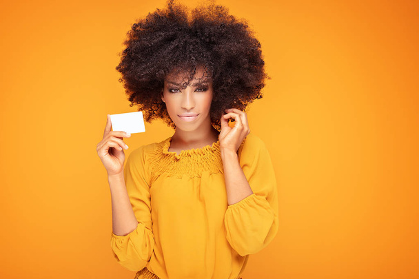 Afro girl holding credit card in hand. - Fotoğraf, Görsel