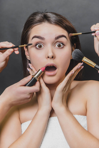 Close up portrait of beauty model girl and make up brushes, lipstick. - Фото, изображение