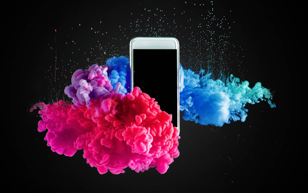 mobile phone in water and color splash mix  - Φωτογραφία, εικόνα