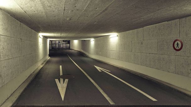 the underground tunnel in the city with arrows - Photo, Image