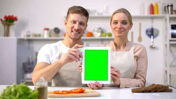 Smiling couple with tablet looking at camera, online food shopping, template - Foto, imagen