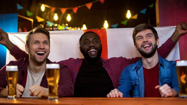 Happy multiracial fans supporting english representatives on song contest, flag - Φωτογραφία, εικόνα