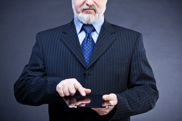 Studio shot handsome businessman holding a digital tablet - Fotografie, Obrázek