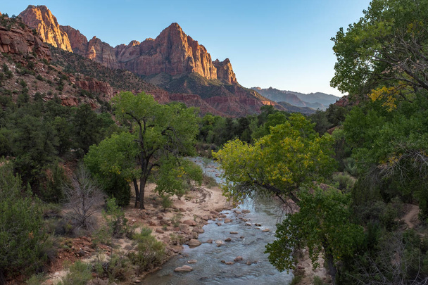 The incredible Zion National Park, sweeping panorama with mountains in the distance and a stream in the foreground - Photo, Image