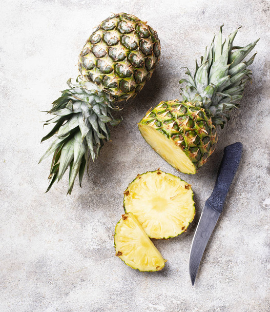 Sliced pineapple on white table - Foto, Imagen