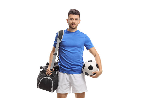 Soccer player with a sports bag and a football - Fotó, kép