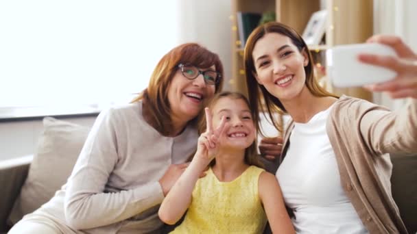 mother, daughter and grandmother taking selfie - Video