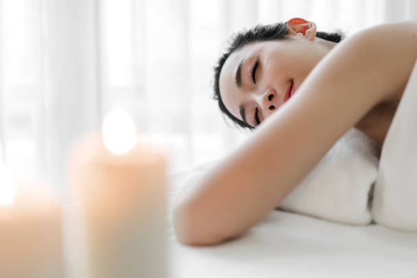 Beautiful young woman beauty skin treatment relaxing lying on to - Photo, Image