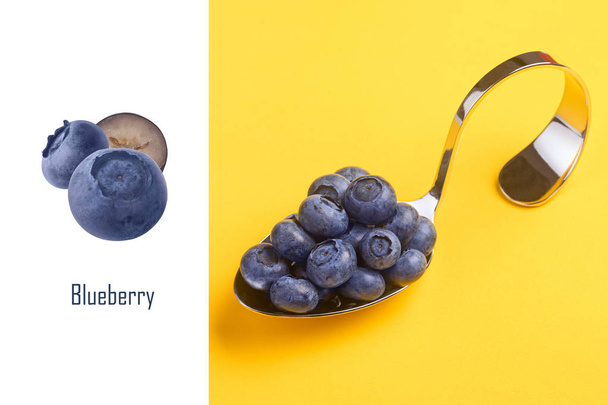 spoon with blueberries layout  - Zdjęcie, obraz