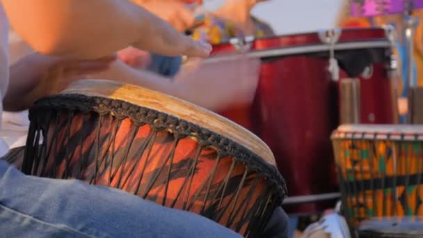 Group of people playing ethnic drums on street - Footage, Video