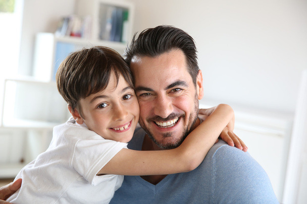 Portrait of father and son relaxing at home - Photo, image