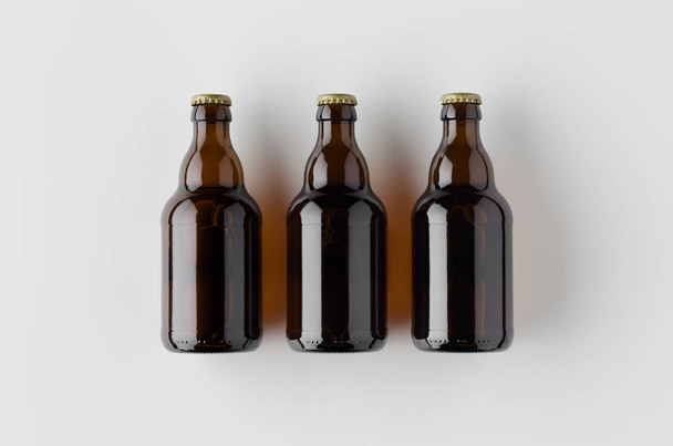 Top view of three beer bottles mockup. - Fotografie, Obrázek