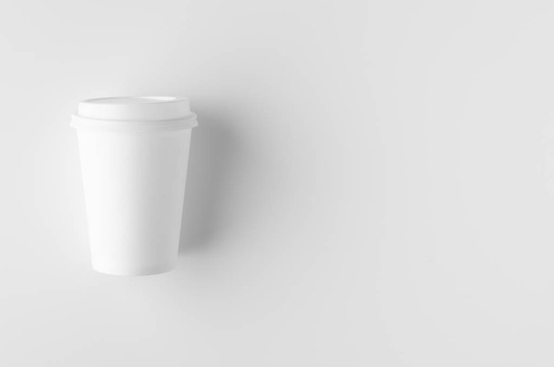 Top view of a 12 oz. white coffee paper cup mockup with lid. - 写真・画像