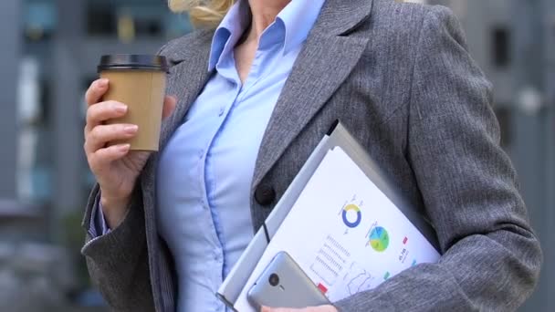 Cheerful businesswoman having coffee break at work, caffeine addiction, closeup - Video