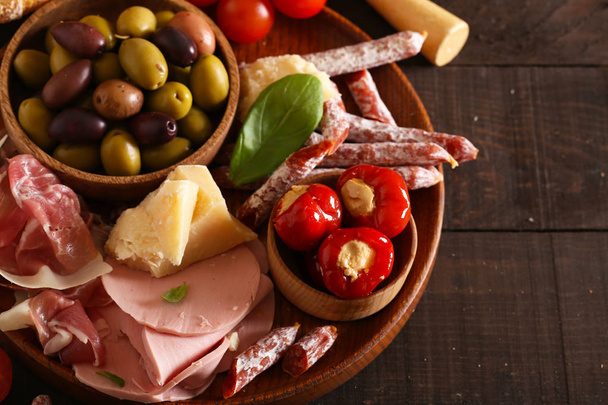 Italian food, prosciutto, olives, cheese and tomatoes - Photo, Image