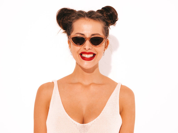 Young beautiful sexy smiling hipster woman with red lips in sunglasses.Trendy girl in summer swimwear bathing suit. Positive female going crazy.Funny model isolated on white.Two horns - Fotografie, Obrázek