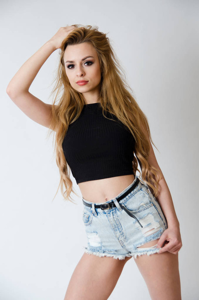 Girl with black top and jeans shorts - Photo, image
