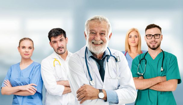 Doctor working in hospital with other doctors. - Photo, Image