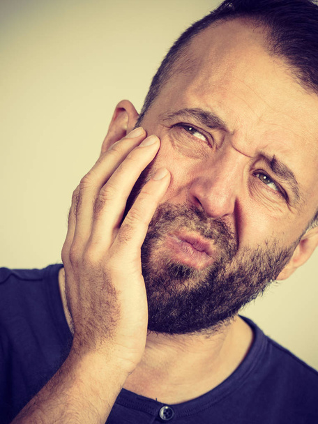 Man having tooth pain - Fotó, kép