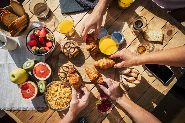 top view of people having breakfast together - 写真・画像