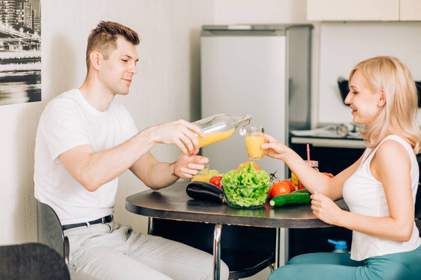 Happy couple eating breakfast together at home - Photo, Image
