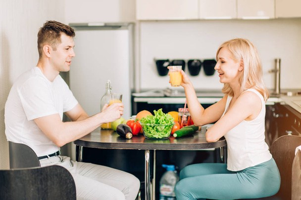 Happy couple eating breakfast together at home - Photo, Image