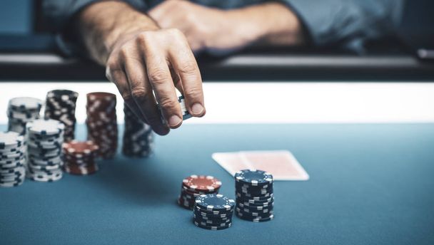 Successful player betting chips at casino - Fotó, kép
