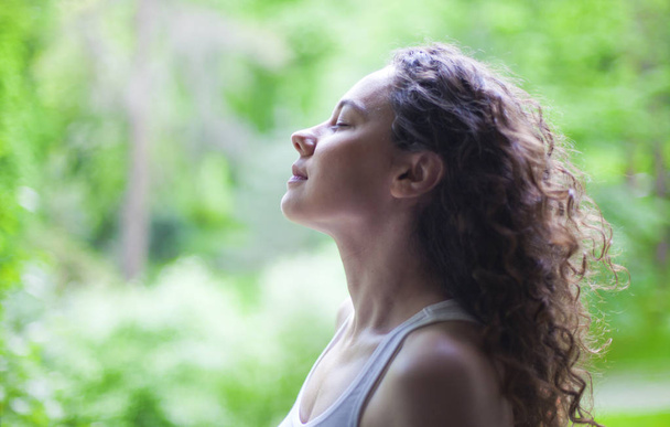 Woman breathing fresh air outdoors in summer - Zdjęcie, obraz