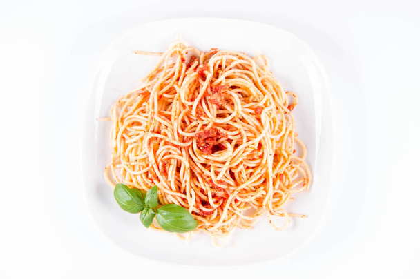 Spaghetti bolognese with melted parmesan cheese  on a white background - Foto, Imagem