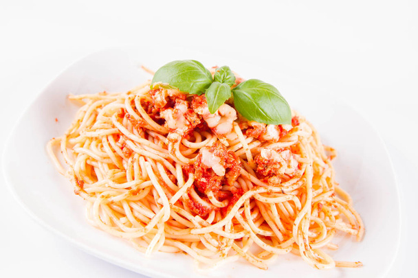 Spaghetti bolognese with melted parmesan cheese  on a white background - Foto, immagini